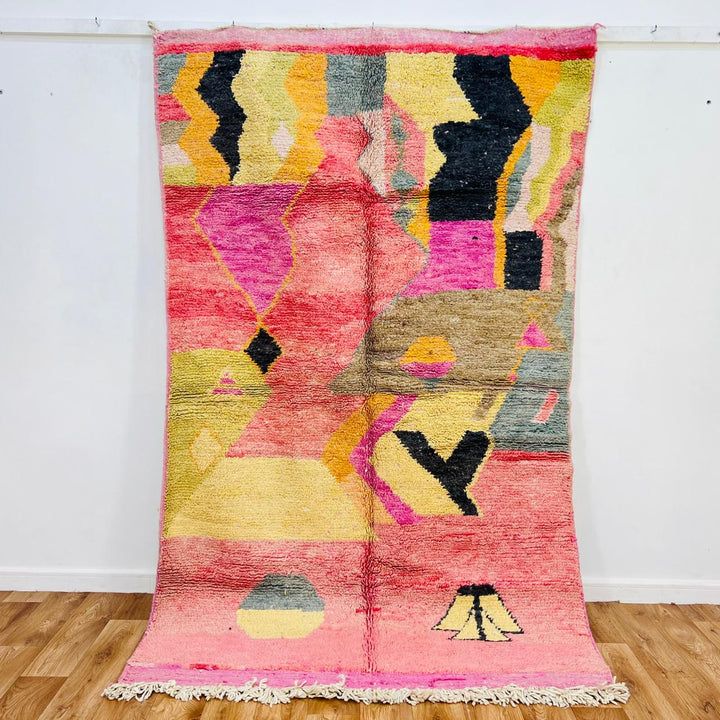 Vintage Moroccan wool rug 606 handmade Berber rug with pink, yellow, and black abstract shapes.