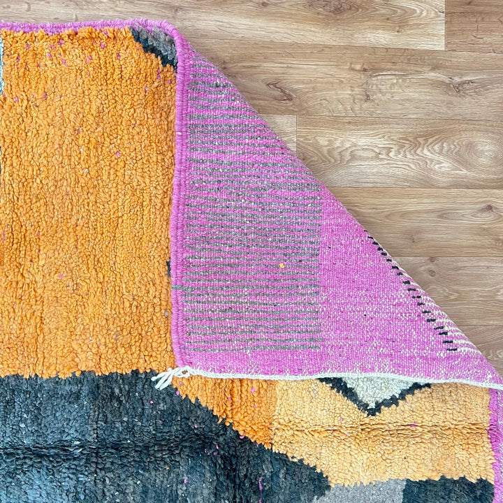 Vintage Moroccan Wool Rug 233 – handmade geometric Berber rug in orange, pink and yellow tones (254 × 154 cm).