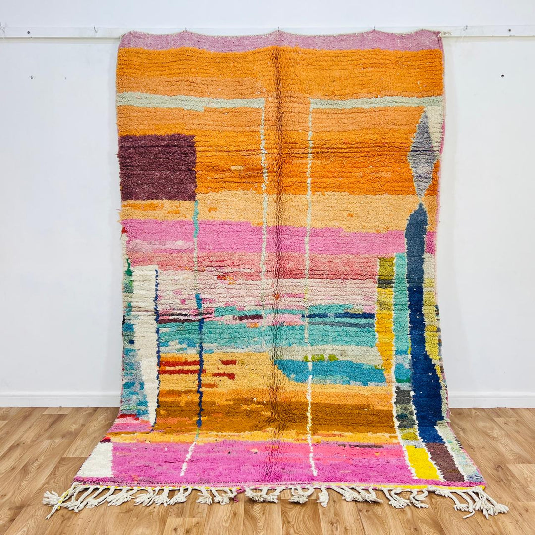 Colorful abstract Moroccan wool rug 659 – handmade 256 × 170 cm (8.39 × 5.57 ft) with pink, orange, turquoise, and yellow tones.