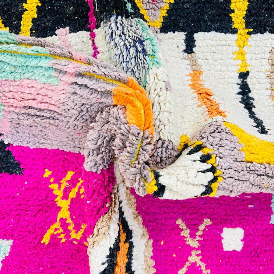 Vintage Moroccan wool rug with colorful Berber geometric symbols, handmade in Morocco