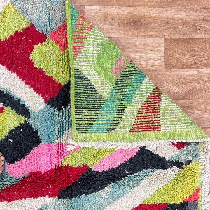 Vintage Moroccan wool rug 210 – handmade colorful geometric Berber design in red, green, pink, and cream (282 × 158 cm).
