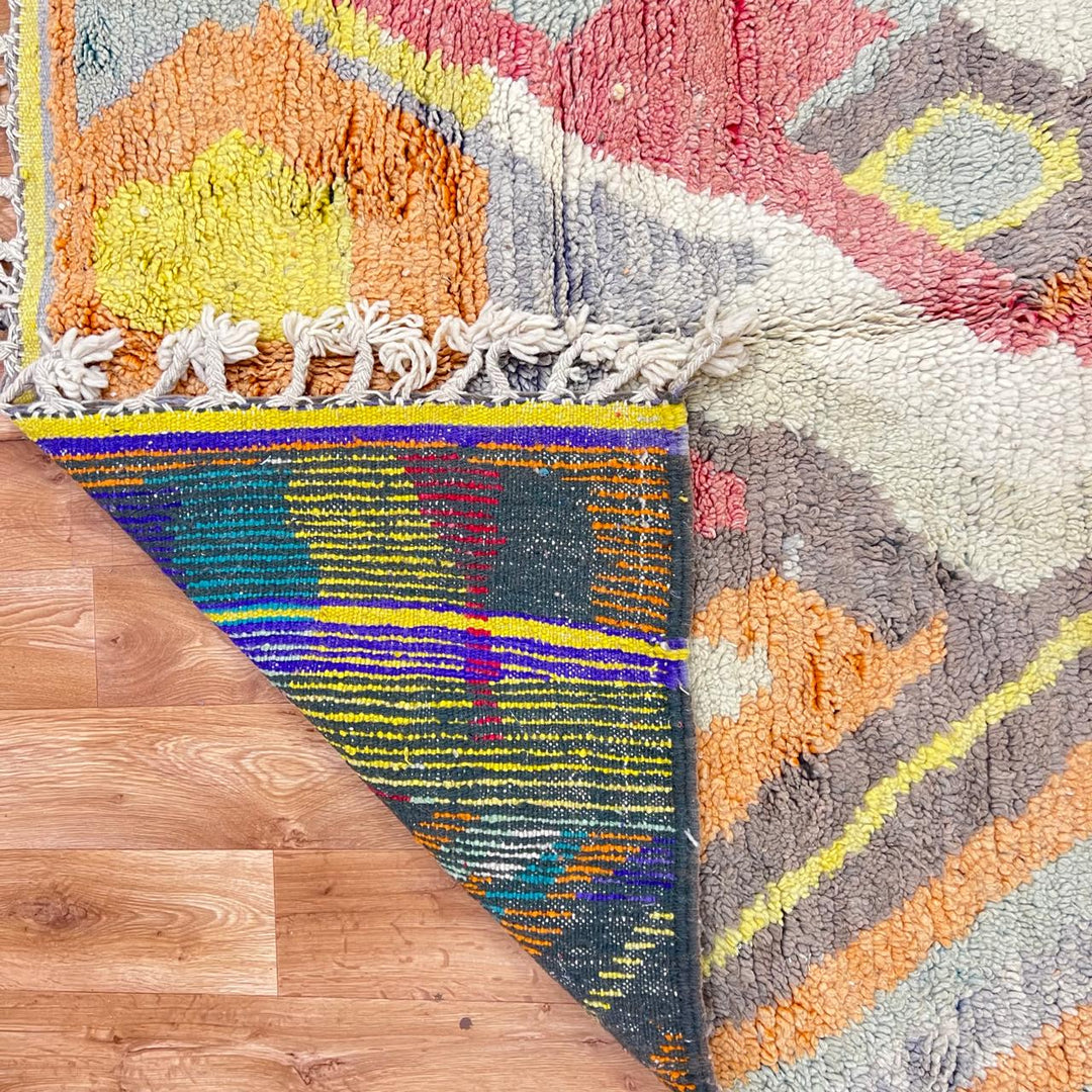 Vintage Moroccan wool rug 396 – handmade abstract earth tone design with yellow, coral, and beige pattern (256 × 148 cm).