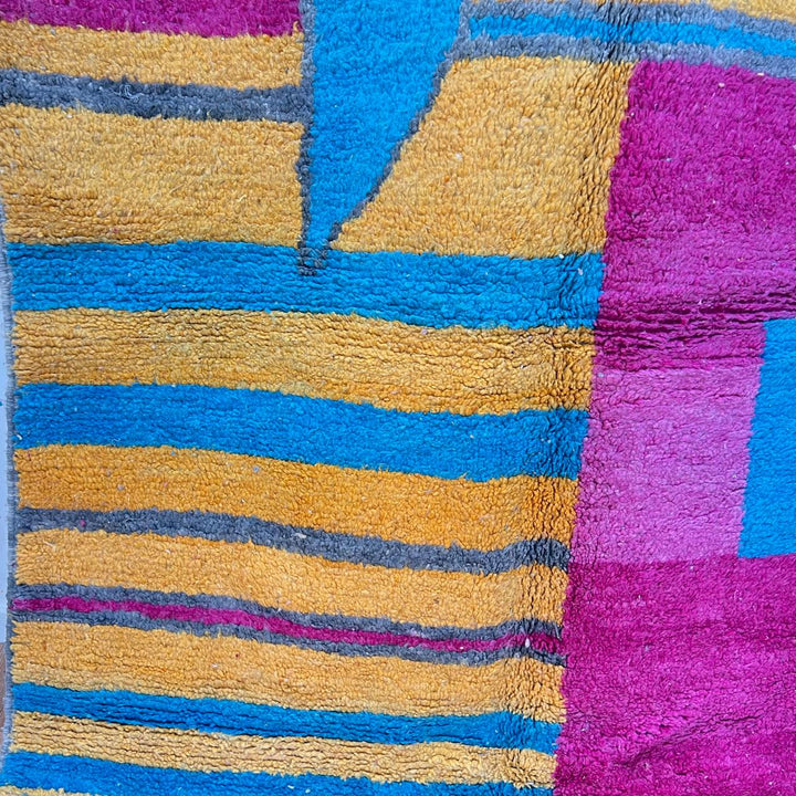 Vintage Moroccan wool rug 193 – handmade colorful abstract Moroccan wool rug in pink, yellow, and blue (250 × 165 cm).