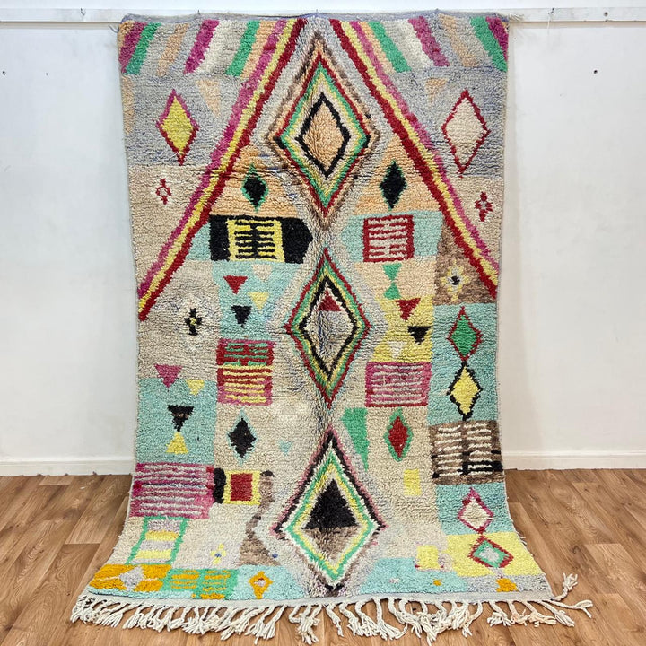 Vintage Moroccan wool rug 137 – handmade colorful geometric Berber design in turquoise, red, and yellow tones (256 × 156 cm).