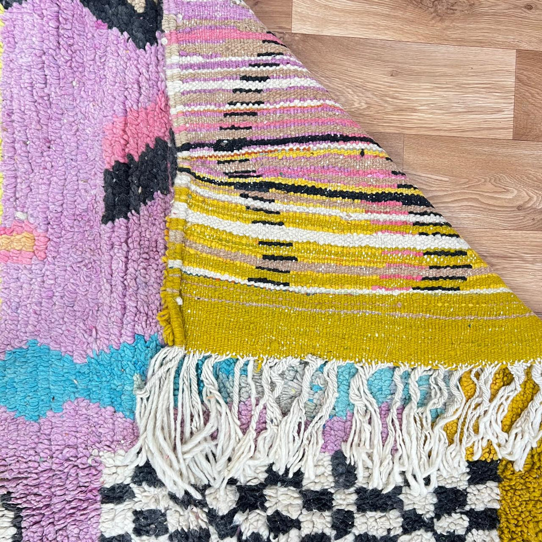 Vintage Moroccan wool rug 729 – handmade pink, yellow, and blue Berber carpet with abstract geometric tribal motifs, 268 × 164 cm (8.79 × 5.38 ft).