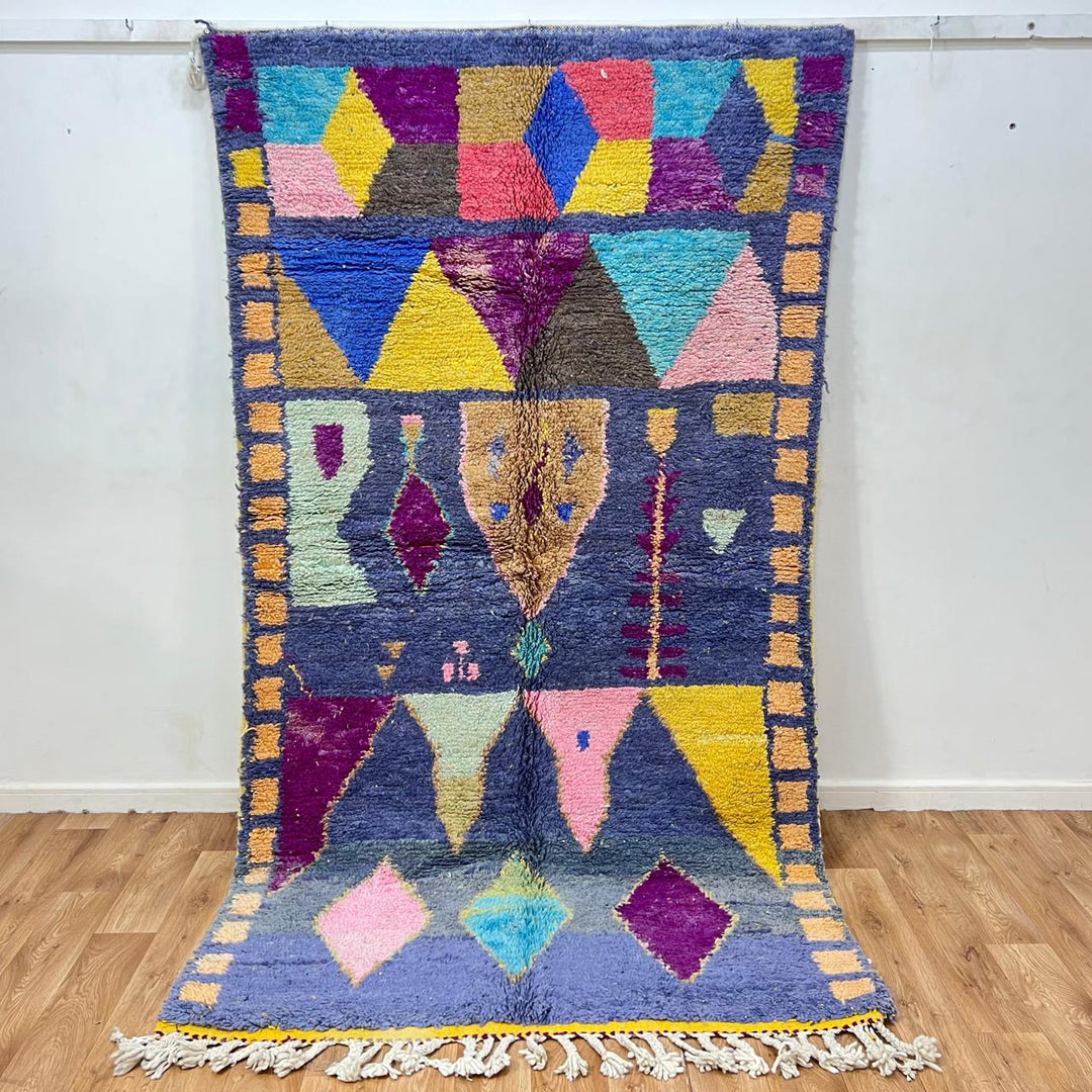 Vintage Moroccan wool rug 158 – handmade geometric colorful pattern in blue, purple, and mustard tones (264 × 147 cm).