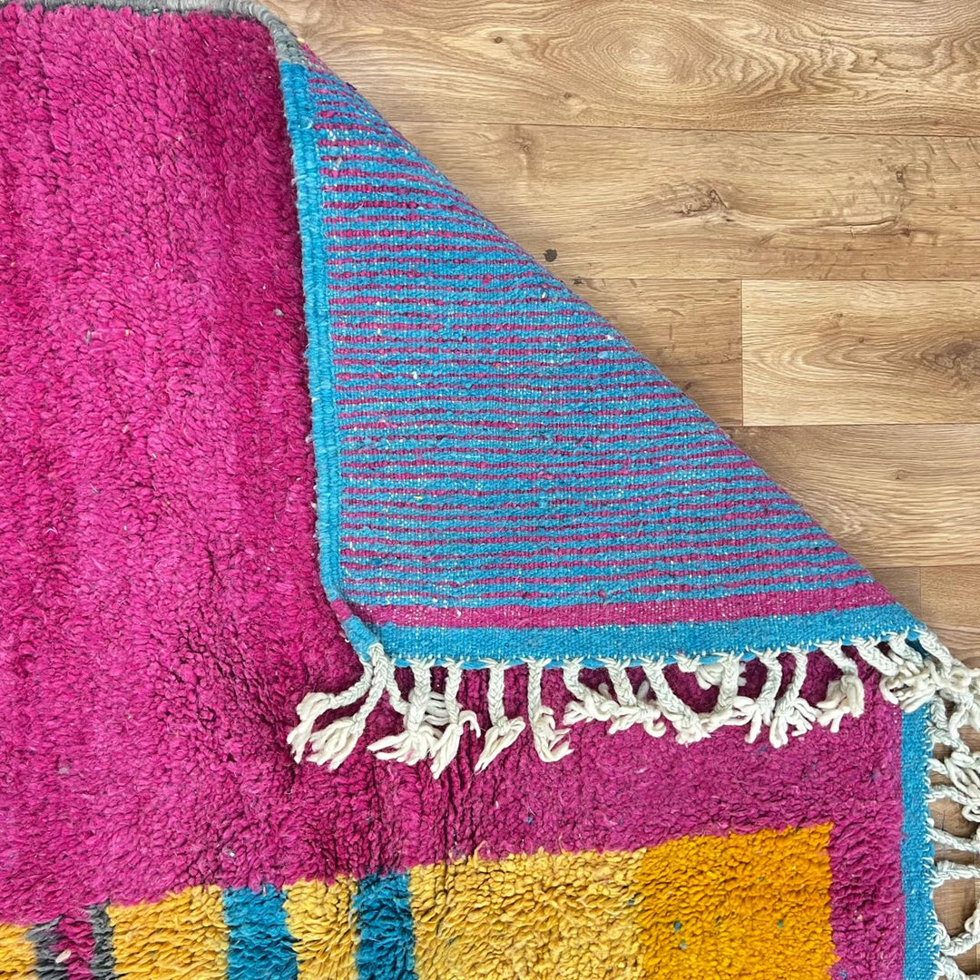 Vintage Moroccan wool rug 193 – handmade colorful abstract Moroccan wool rug in pink, yellow, and blue (250 × 165 cm).
