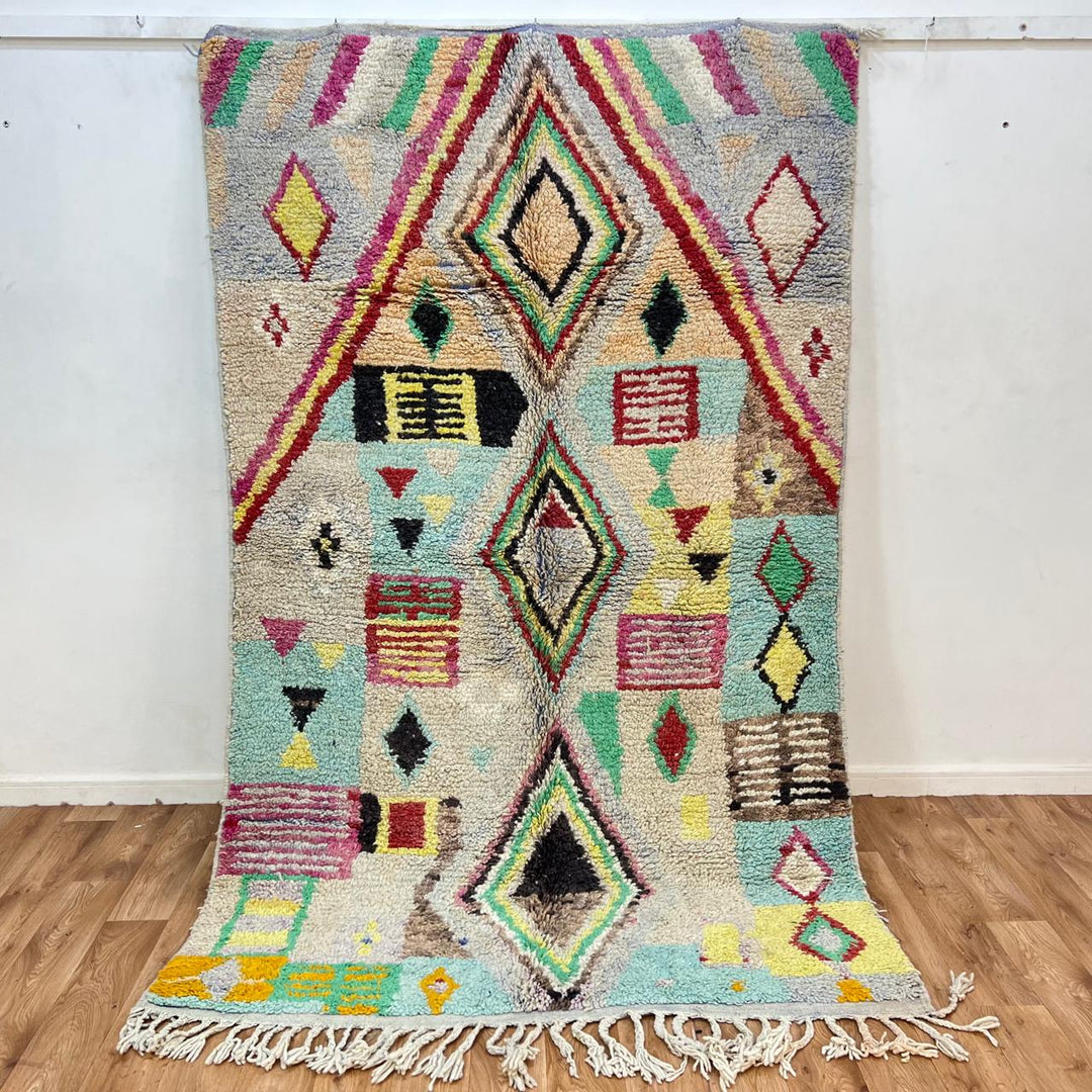 Vintage Moroccan wool rug 137 – handmade colorful geometric Berber design in turquoise, red, and yellow tones (256 × 156 cm).