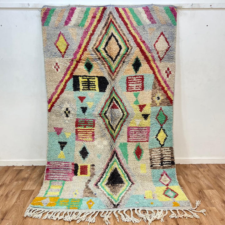 Vintage Moroccan wool rug 137 – handmade colorful geometric Berber design in turquoise, red, and yellow tones (256 × 156 cm).