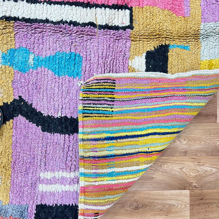 Vintage Moroccan wool rug 729 – handmade pink, yellow, and blue Berber carpet with abstract geometric tribal motifs, 268 × 164 cm (8.79 × 5.38 ft).