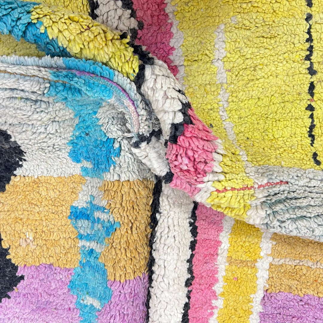 Vintage Moroccan wool rug 729 – handmade pink, yellow, and blue Berber carpet with abstract geometric tribal motifs, 268 × 164 cm (8.79 × 5.38 ft).