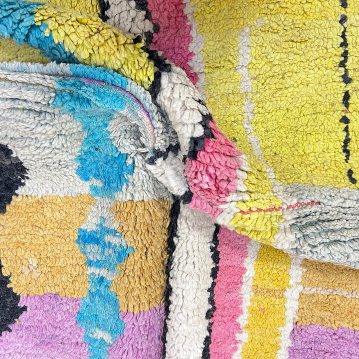 Vintage Moroccan wool rug 729 – handmade pink, yellow, and blue Berber carpet with abstract geometric tribal motifs, 268 × 164 cm (8.79 × 5.38 ft).