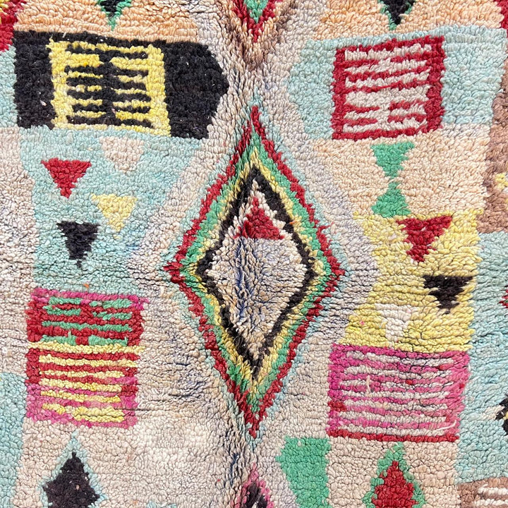 Vintage Moroccan wool rug 137 – handmade colorful geometric Berber design in turquoise, red, and yellow tones (256 × 156 cm).