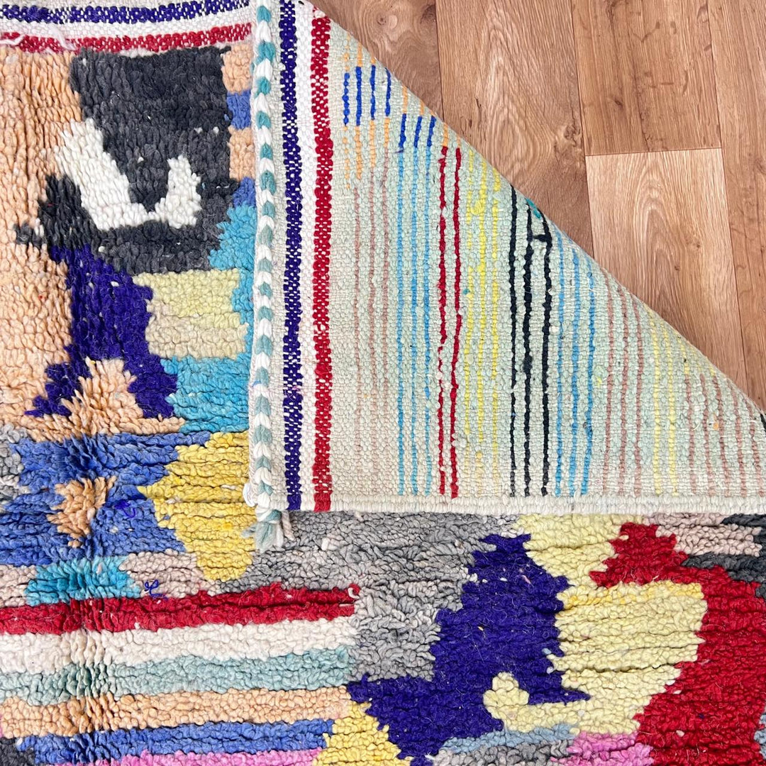 Vintage Moroccan wool rug 732 – handwoven Berber carpet with colorful abstract geometric motifs in red, blue, yellow, and beige, 240 × 152 cm (7.87 × 4.98 ft).