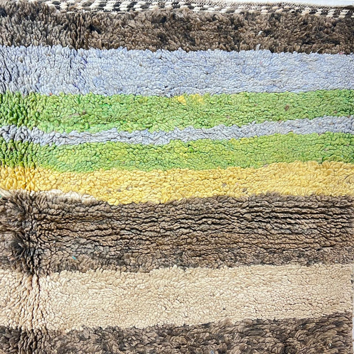 Vintage Moroccan wool rug 787 – handwoven Berber carpet in natural brown, beige, and green tones with soft geometric stripes, 244 × 163 cm (8.00 × 5.34 ft).