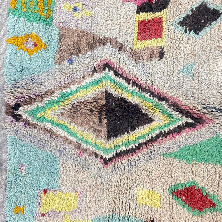 Vintage Moroccan wool rug 137 – handmade colorful geometric Berber design in turquoise, red, and yellow tones (256 × 156 cm).