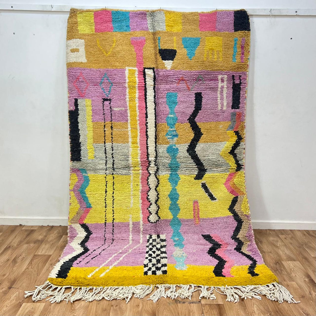 Vintage Moroccan wool rug 729 – handmade pink, yellow, and blue Berber carpet with abstract geometric tribal motifs, 268 × 164 cm (8.79 × 5.38 ft).