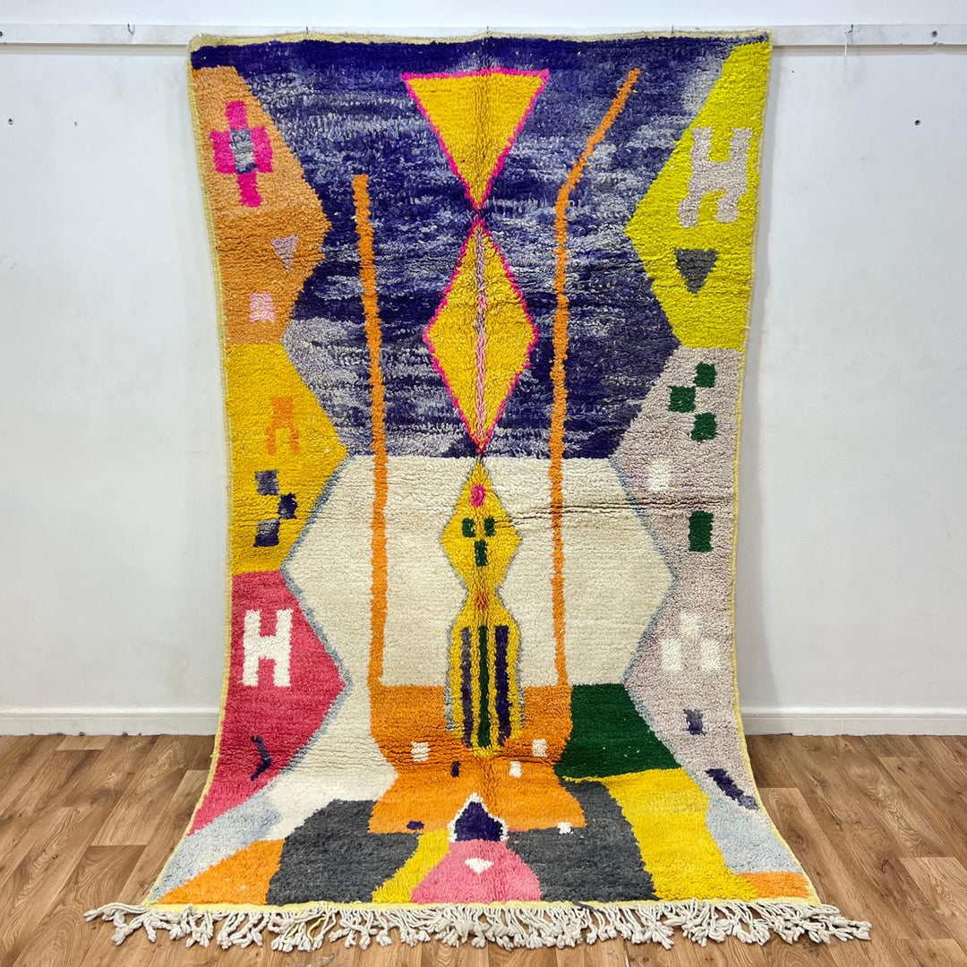 Vintage Moroccan wool rug 143 – handmade yellow, purple, and cream geometric Berber design (250 × 150 cm).