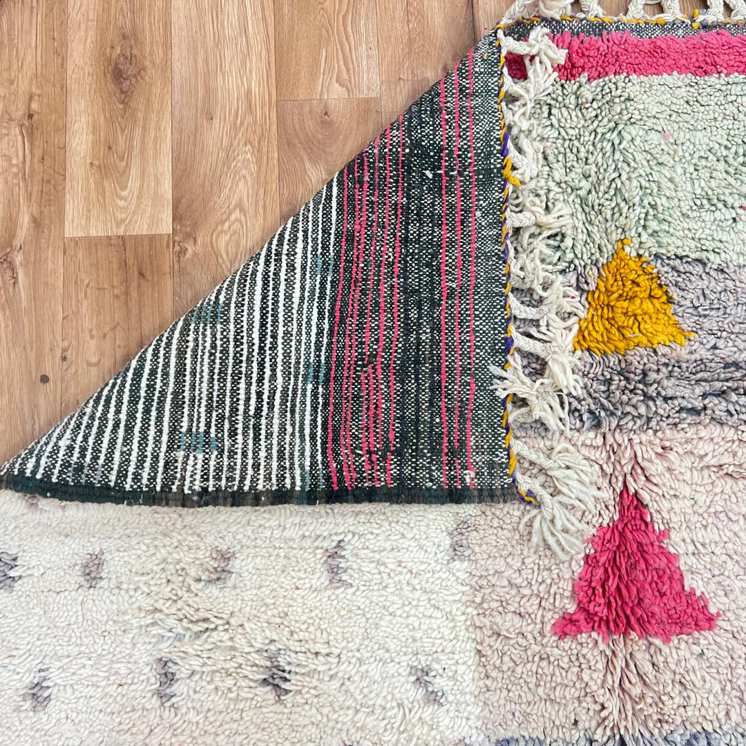 Vintage Moroccan wool rug 199 – handmade geometric pink, mustard, and cream design (251 × 158 cm).