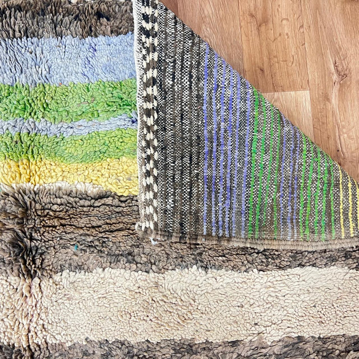 Vintage Moroccan wool rug 787 – handwoven Berber carpet in natural brown, beige, and green tones with soft geometric stripes, 244 × 163 cm (8.00 × 5.34 ft).