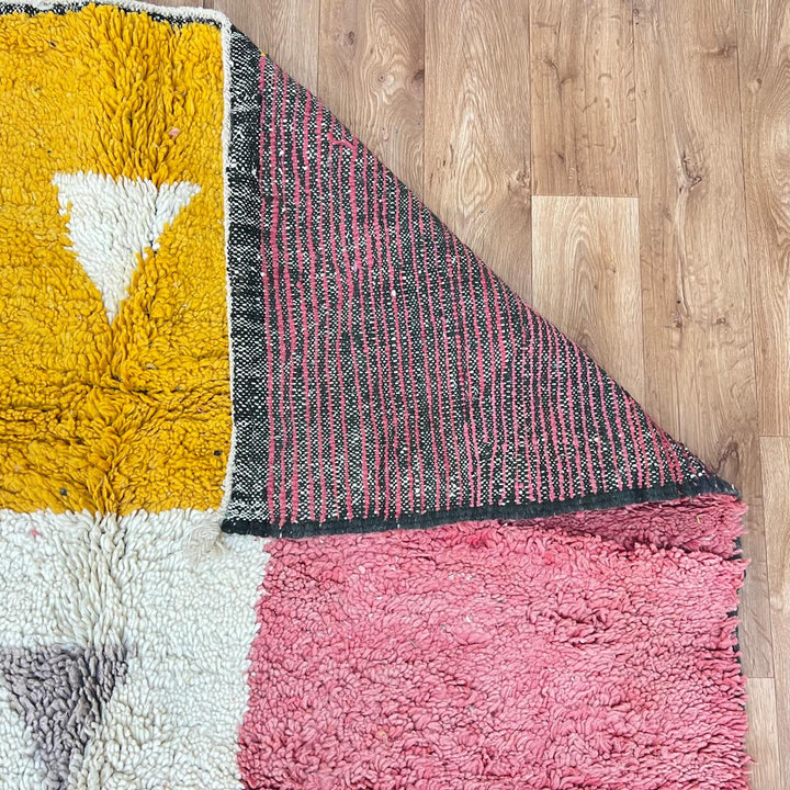 Vintage Moroccan wool rug 199 – handmade geometric pink, mustard, and cream design (251 × 158 cm).
