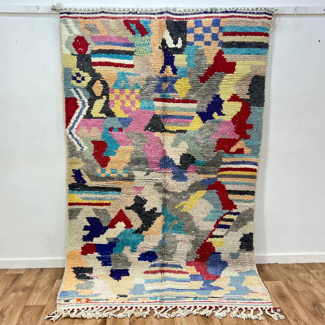 Vintage Moroccan wool rug 732 – handwoven Berber carpet with colorful abstract geometric motifs in red, blue, yellow, and beige, 240 × 152 cm (7.87 × 4.98 ft).