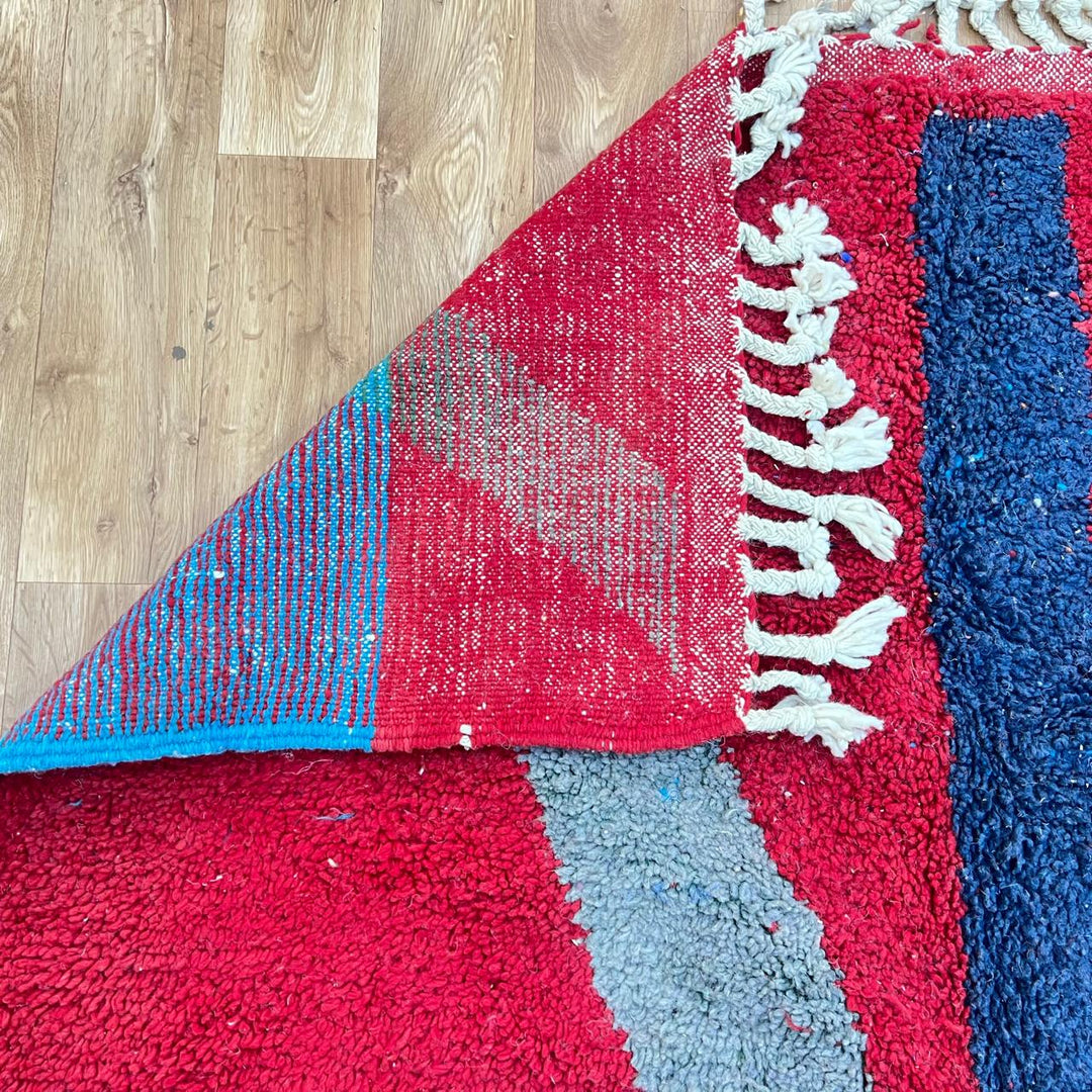 Vintage Moroccan wool rug 201 – handmade red, blue, and orange abstract geometric design (243 × 159 cm).
