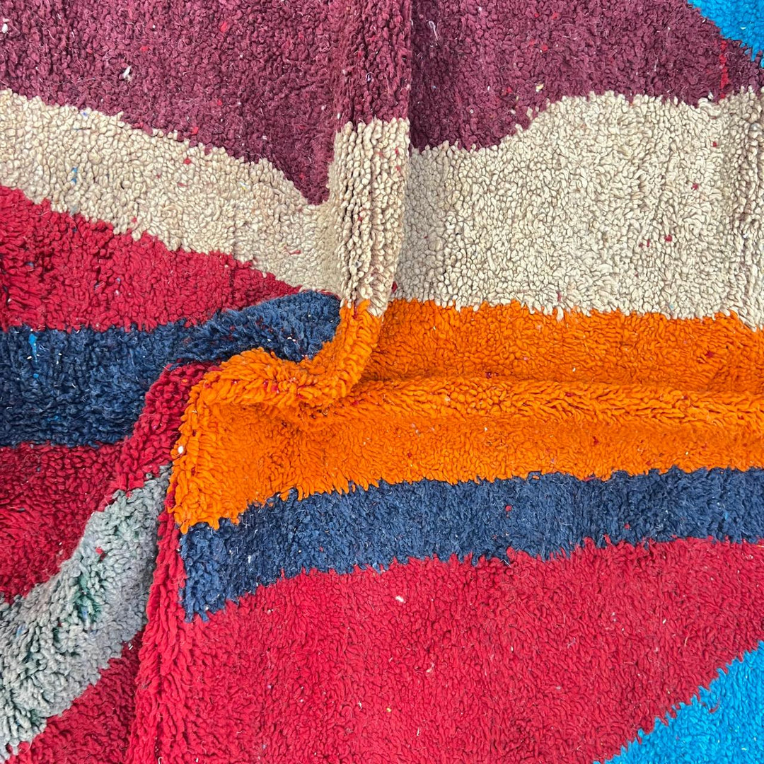 Vintage Moroccan wool rug 201 – handmade red, blue, and orange abstract geometric design (243 × 159 cm).