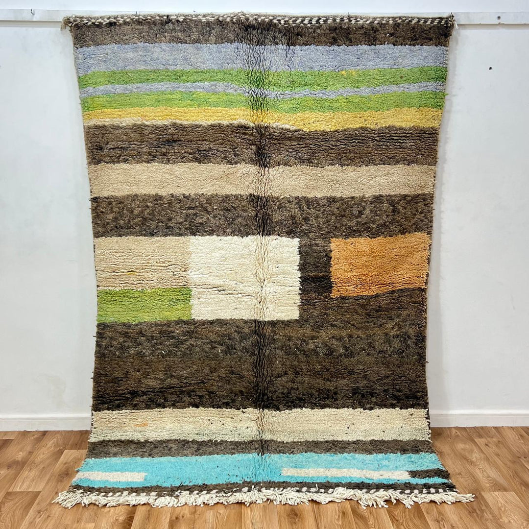 Vintage Moroccan wool rug 787 – handwoven Berber carpet in natural brown, beige, and green tones with soft geometric stripes, 244 × 163 cm (8.00 × 5.34 ft).
