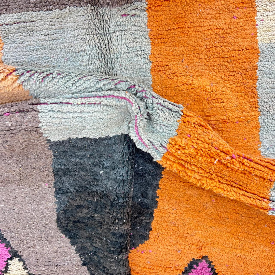 Vintage Moroccan Wool Rug 233 – handmade geometric Berber rug in orange, pink and yellow tones (254 × 154 cm).