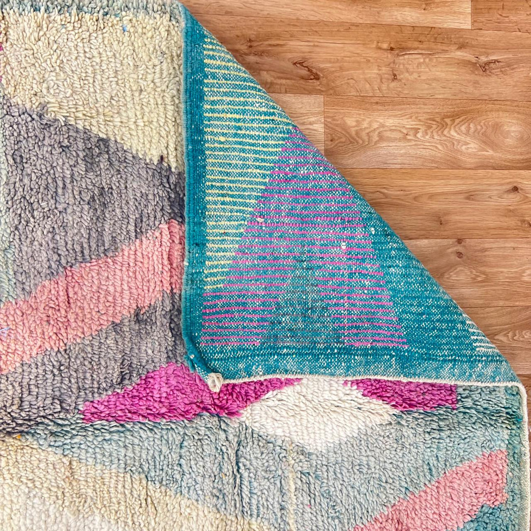 Vintage Moroccan Wool Rug 182 – handmade geometric pastel Moroccan rug in pink, teal, and beige tones (268 × 149 cm).