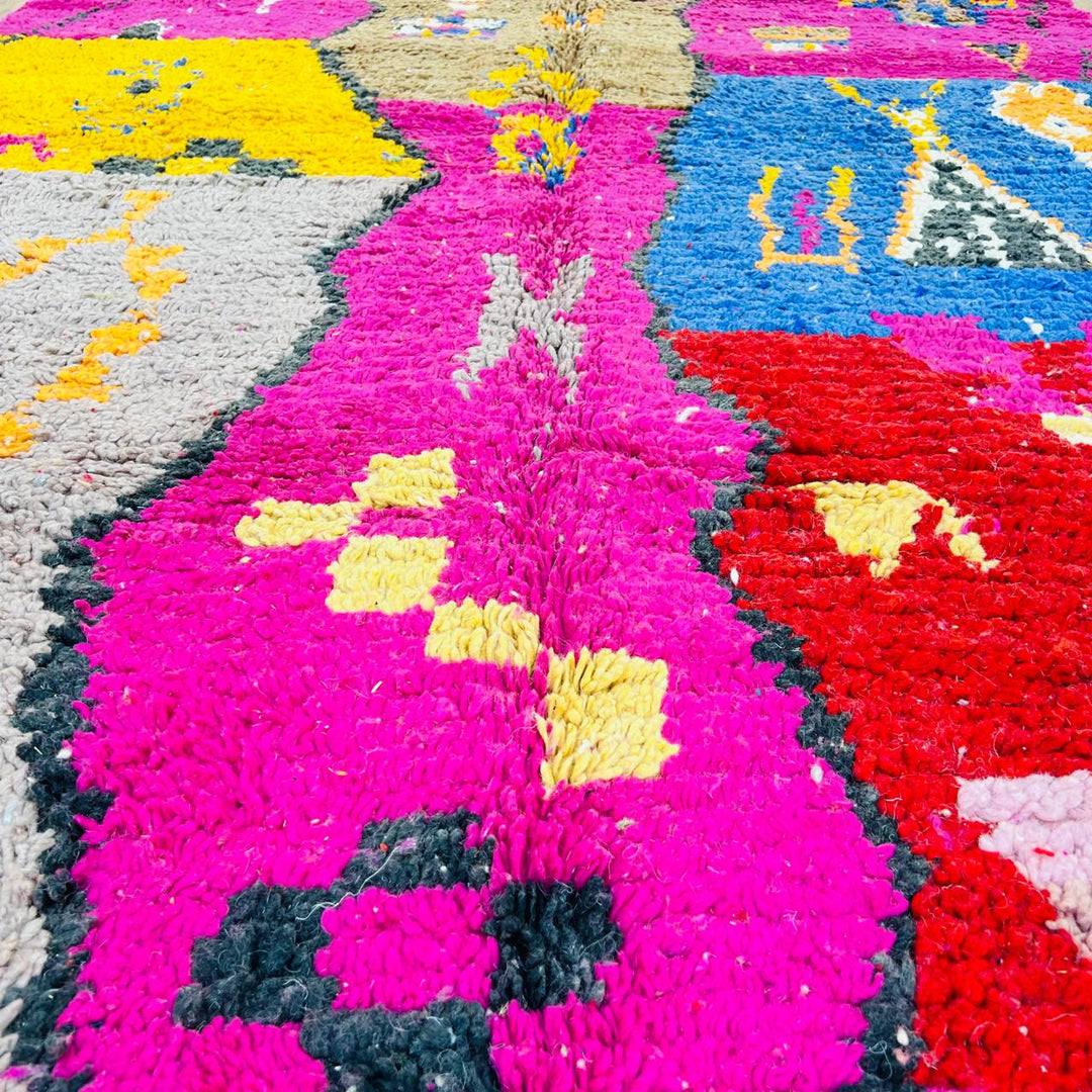 Vintage Moroccan rug with colorful Berber geometric patterns in pink, yellow, blue and red, handmade wool carpet from Morocco