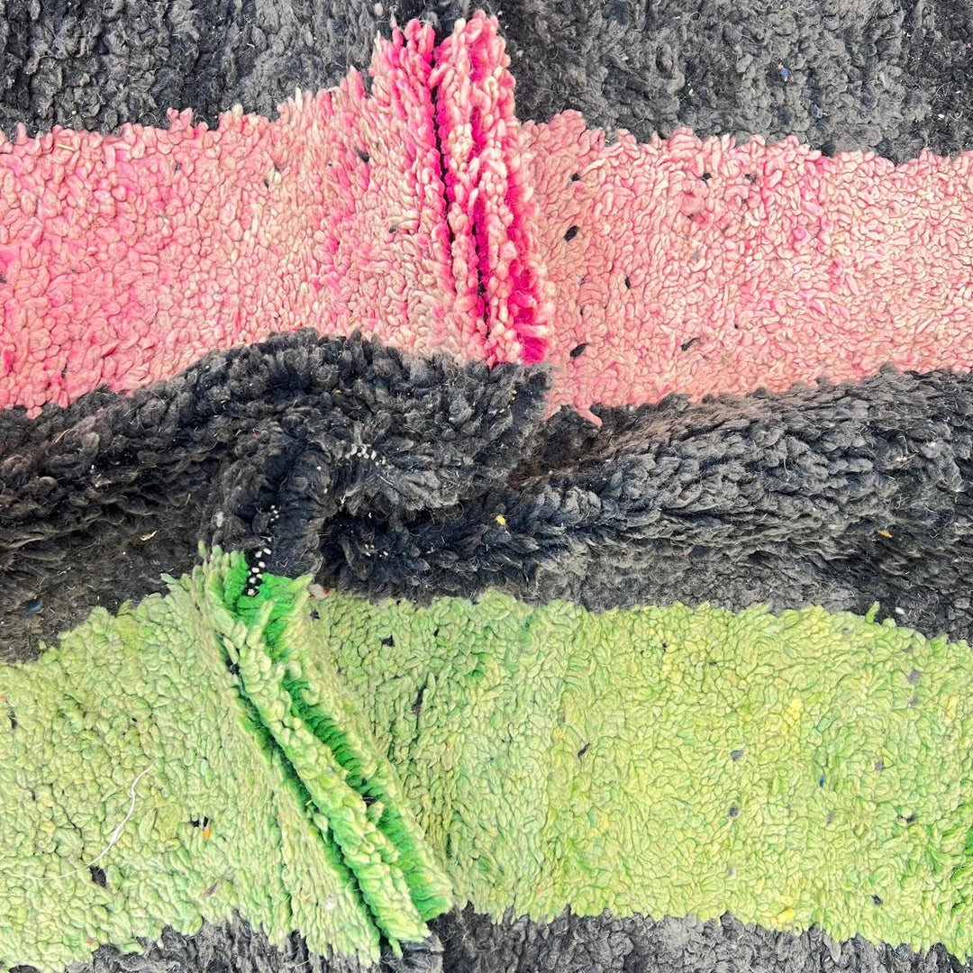 Vintage Moroccan wool rug 731 – handmade Berber carpet with black, green, pink, and grey abstract tribal patterns (233 × 147 cm / 7.64 × 4.82 ft).