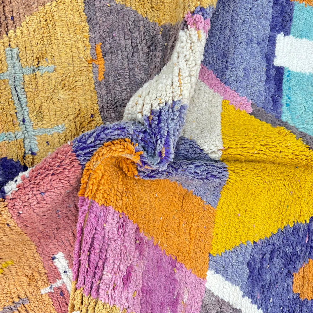 Vintage Moroccan wool rug 257 – handmade Berber rug with vibrant geometric design in orange, yellow, purple, and blue (264 × 162 cm).