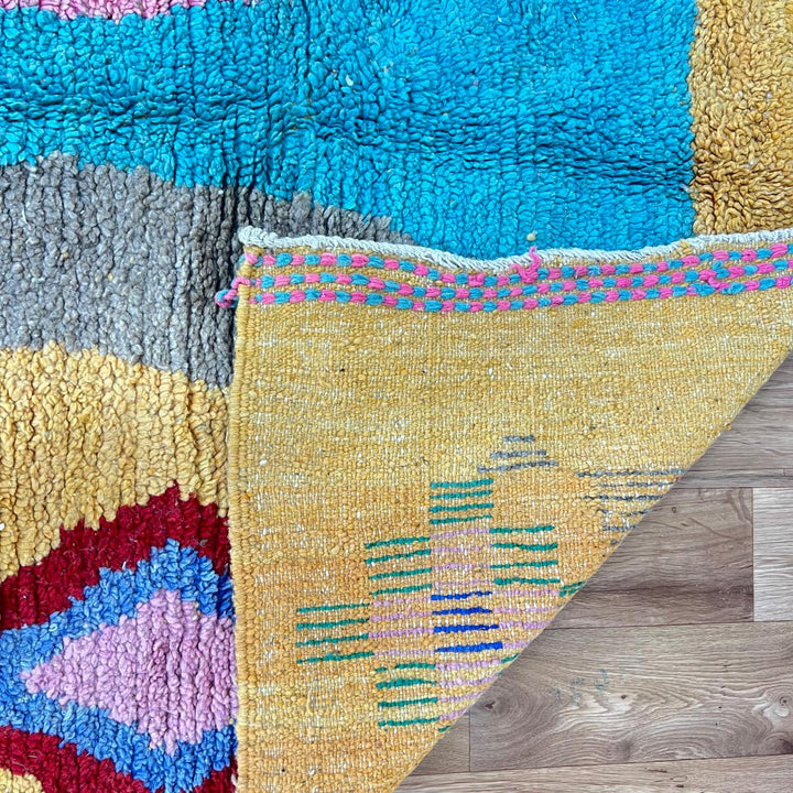 Vintage Moroccan wool rug 763 – handmade colorful Berber carpet with yellow, turquoise, pink, and red geometric diamond patterns (283 × 162 cm / 9.28 × 5.31 ft).