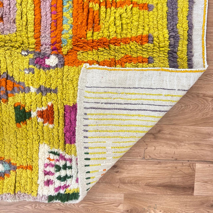 Vintage Moroccan Wool Rug 14 – handmade yellow and green Berber rug with colorful tribal motifs (211 × 126 cm).