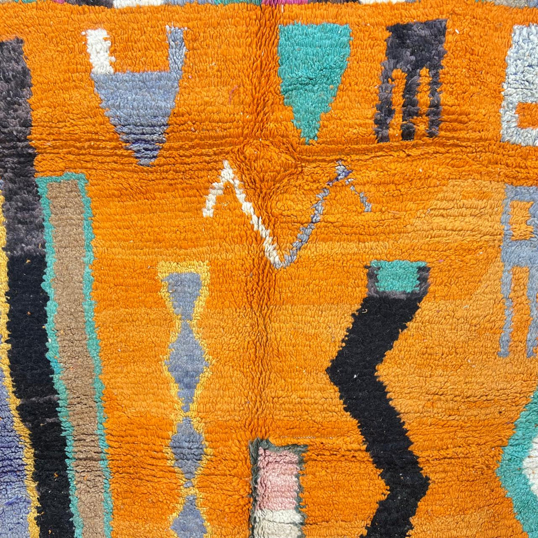 Vintage Moroccan wool rug 324 – handmade Berber carpet with bright orange base and multicolor geometric tribal design, 260 × 190 cm (8.53 × 6.23 ft).