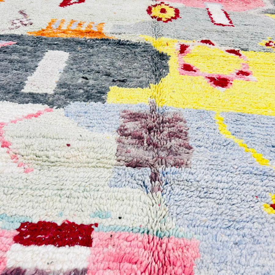 Vintage Moroccan wool rug with colorful abstract Berber geometric patterns in grey, pink, yellow and ivory, handmade in Morocco, 257x158 cm