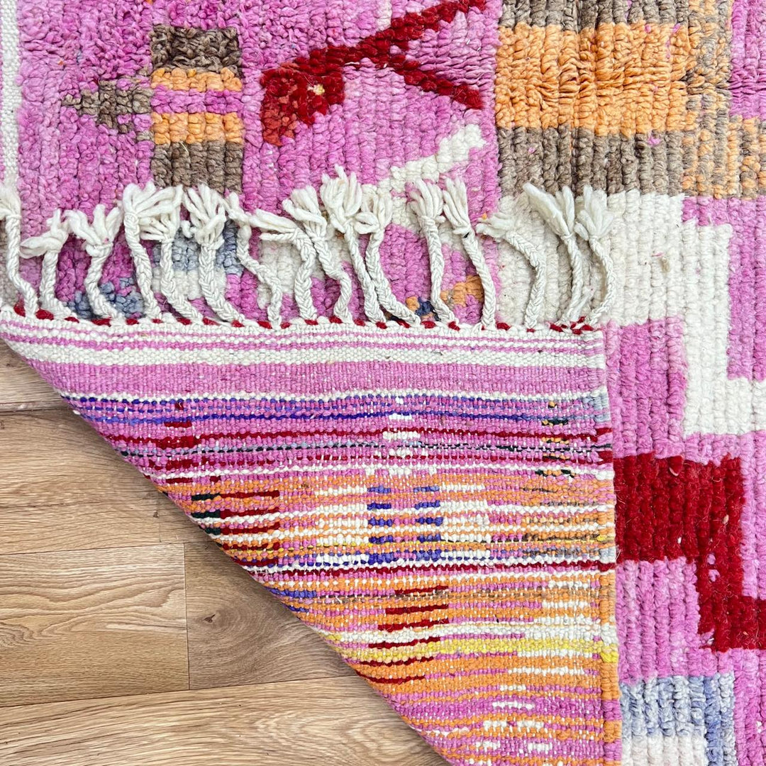 Vintage Moroccan wool rug 776 – colorful handmade Berber carpet with pink, red, and beige geometric patterns, 262 × 168 cm (8.59 × 5.51 ft).