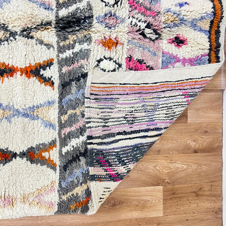 Vintage Moroccan wool rug 259 – handmade tribal diamond pattern in cream, charcoal, and color accents (253 × 160 cm).