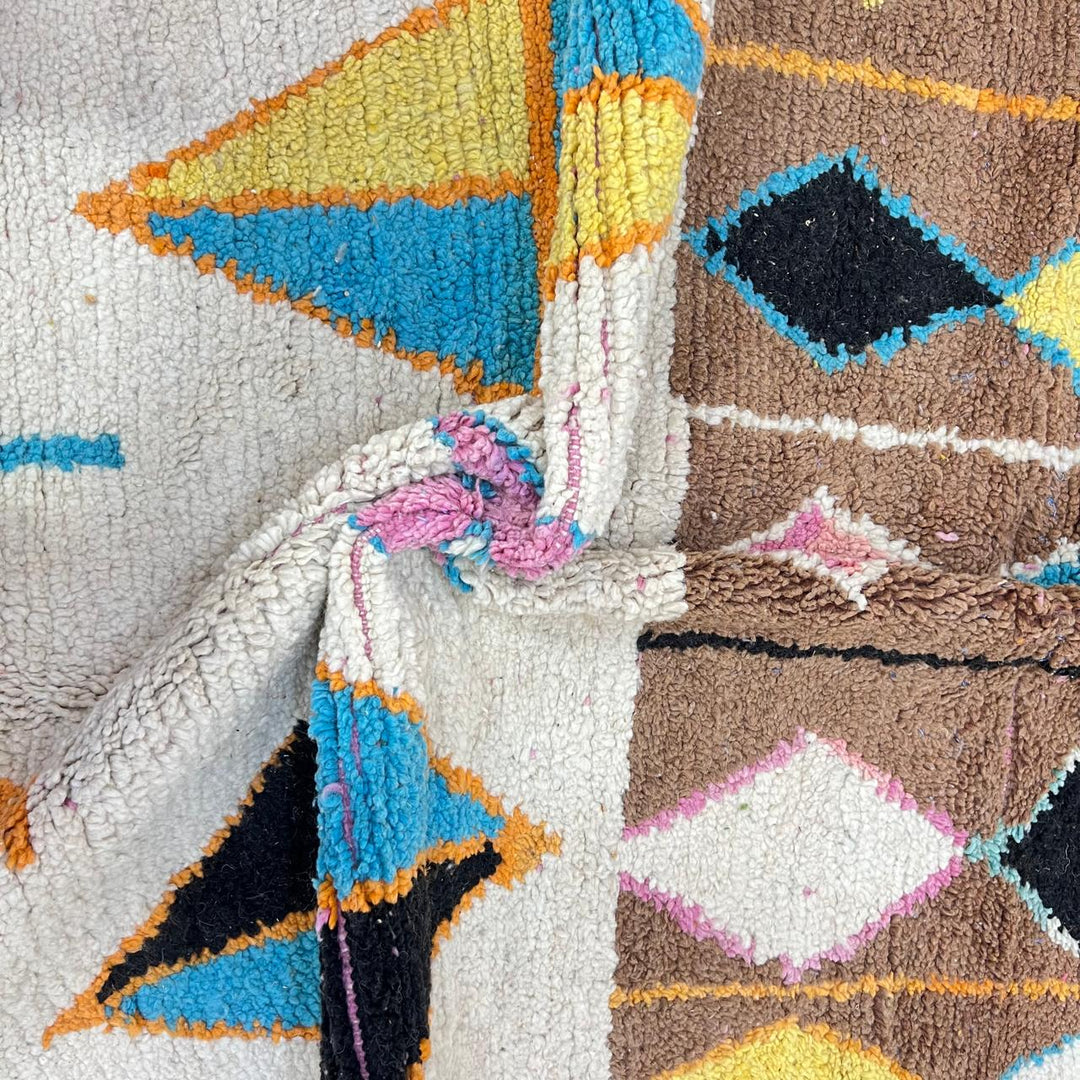 Vintage Moroccan wool rug 251 – handmade colorful geometric Berber rug with orange, turquoise, and yellow diamonds (252 × 150 cm).