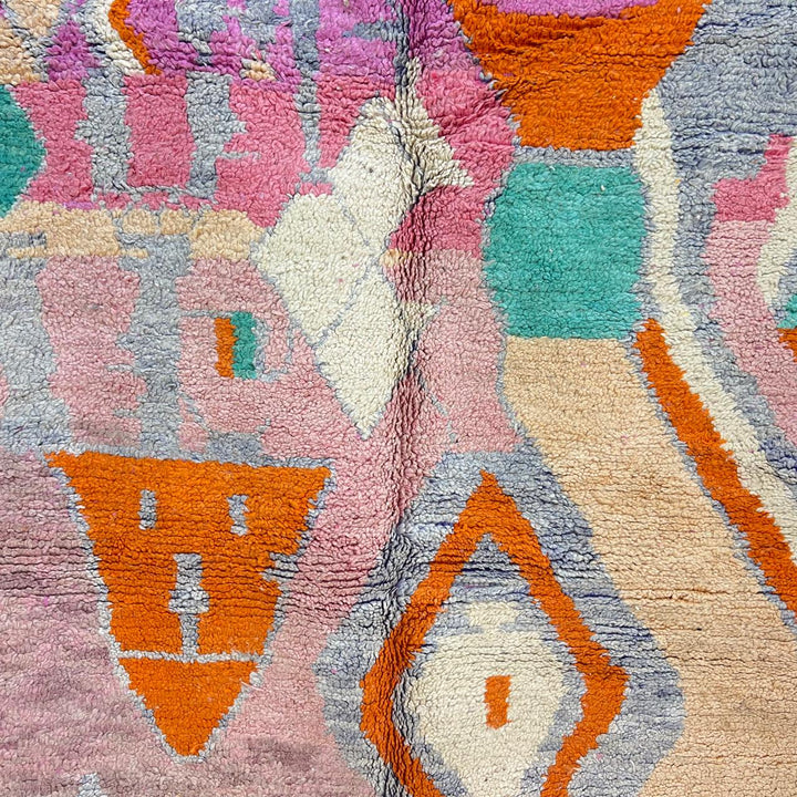 Vintage Moroccan wool rug in pink and orange tones with abstract Berber geometric patterns, handmade in Morocco
