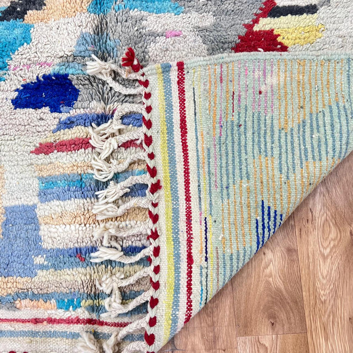 Vintage Moroccan wool rug 732 – handwoven Berber carpet with colorful abstract geometric motifs in red, blue, yellow, and beige, 240 × 152 cm (7.87 × 4.98 ft).