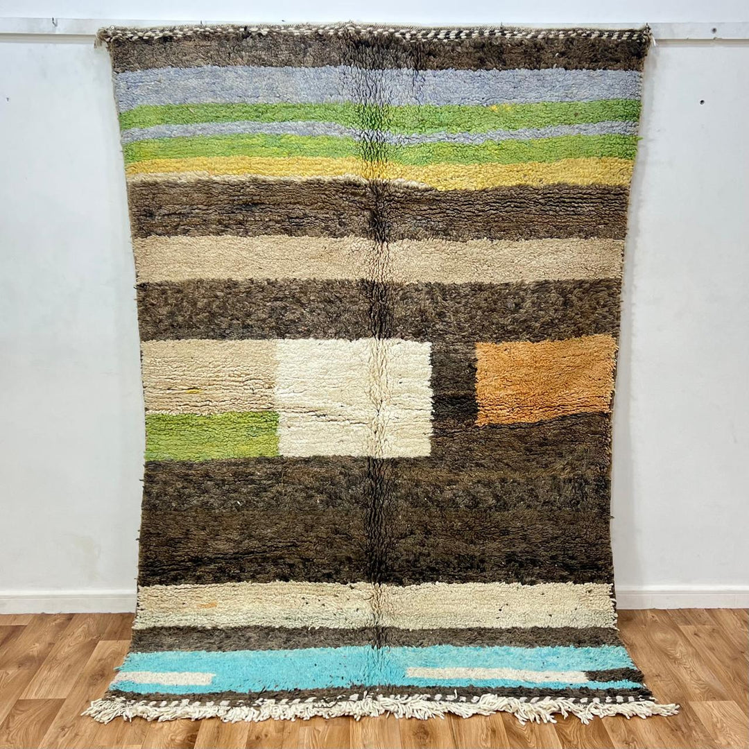 Vintage Moroccan wool rug 787 – handwoven Berber carpet in natural brown, beige, and green tones with soft geometric stripes, 244 × 163 cm (8.00 × 5.34 ft).