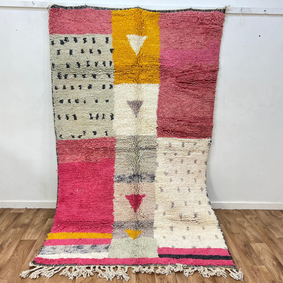 Vintage Moroccan wool rug 199 – handmade geometric pink, mustard, and cream design (251 × 158 cm).