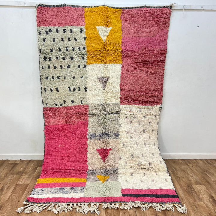 Vintage Moroccan wool rug 199 – handmade geometric pink, mustard, and cream design (251 × 158 cm).