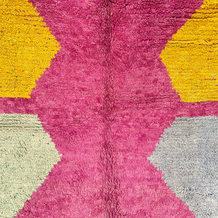 Vintage Moroccan wool rug 141 – handmade geometric pattern in pink, yellow, and blue tones (268 × 161 cm).