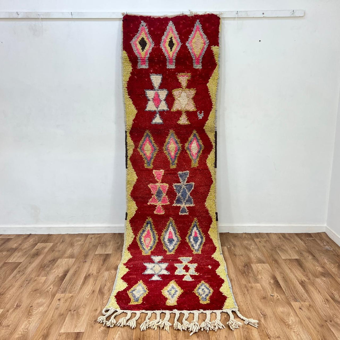 Vintage Moroccan wool rug 820 – red Berber runner with yellow borders and geometric diamond motifs (290 × 84 cm / 9.51 × 2.75 ft).