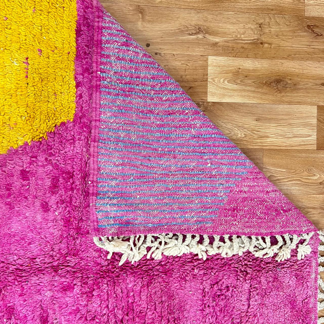 Vintage Moroccan wool rug 141 – handmade geometric pattern in pink, yellow, and blue tones (268 × 161 cm).