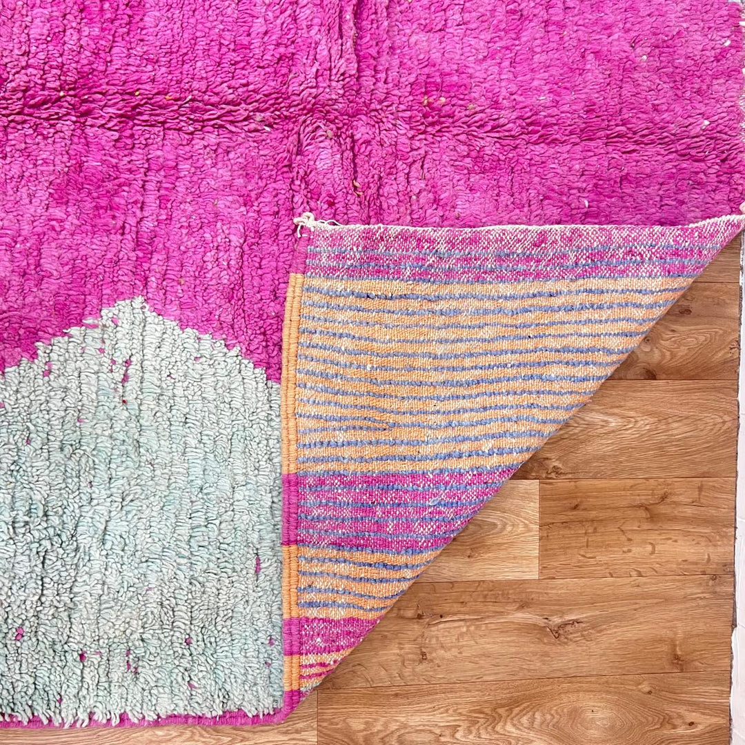 Vintage Moroccan wool rug 141 – handmade geometric pattern in pink, yellow, and blue tones (268 × 161 cm).